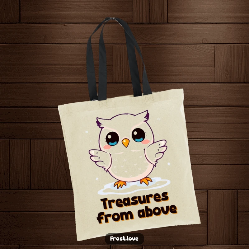 Funny tote bag displaying a kawaii snow owl character gently catching snowflakes, a symbol of winter's delicate beauty and fun.